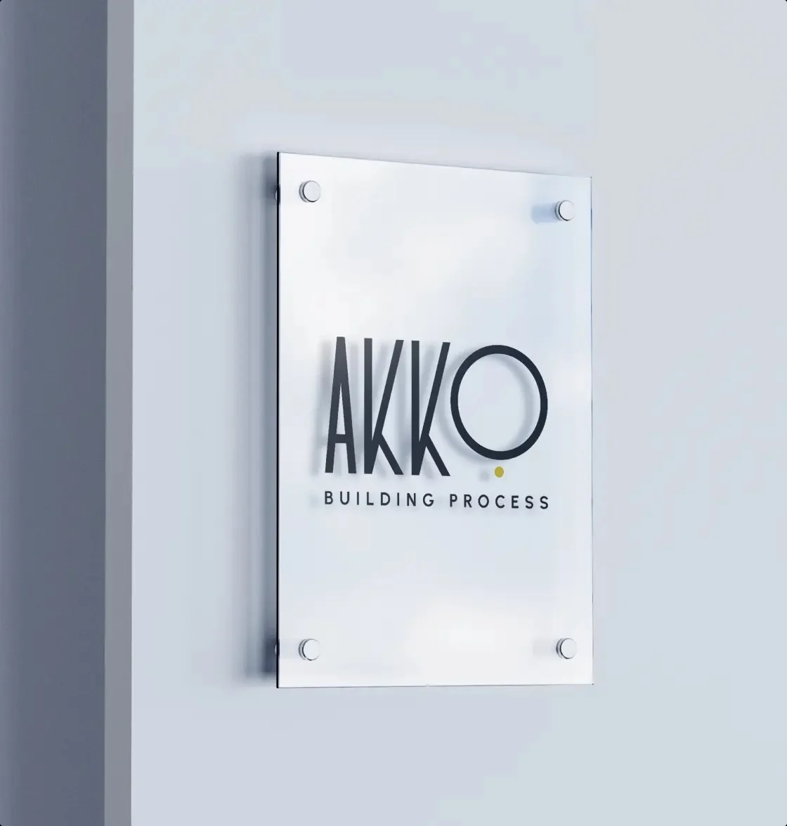 Rótulo de AKKO Building Process sobre una placa de vidrio.